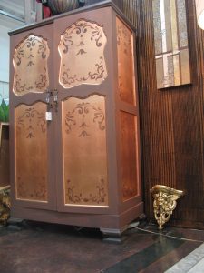 aged cupboard with copper leafed panels and stencil detail
