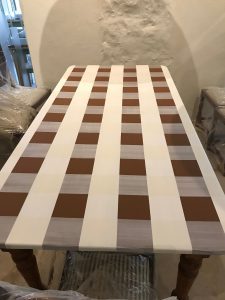 painted checked tablecloth on table