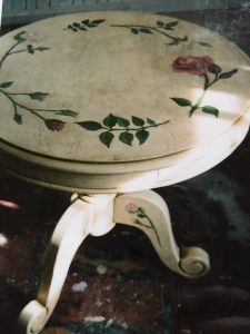 antiqued table with rose motif