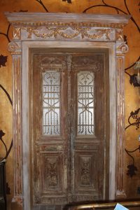 distressed whitewashed doors with gold leaf detail