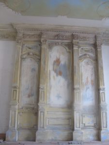 distressed carved feature