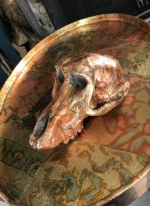variegated copper leaf skull and table