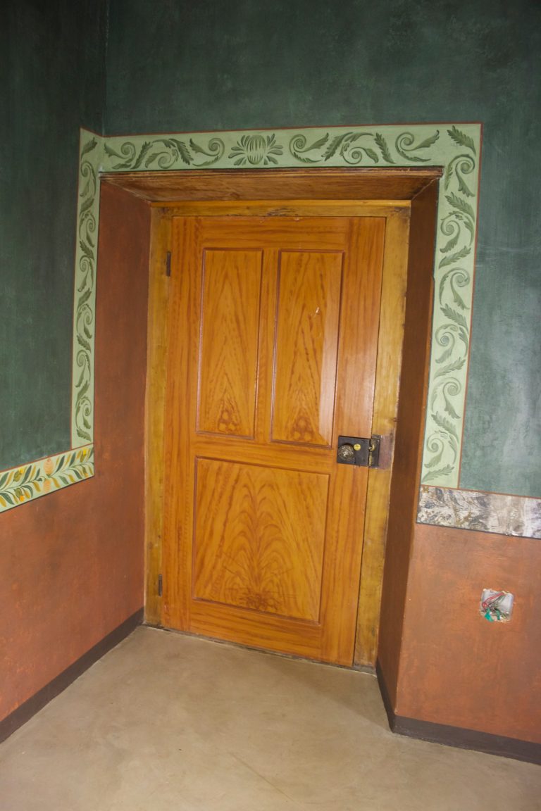 aged walls with stencilled dado