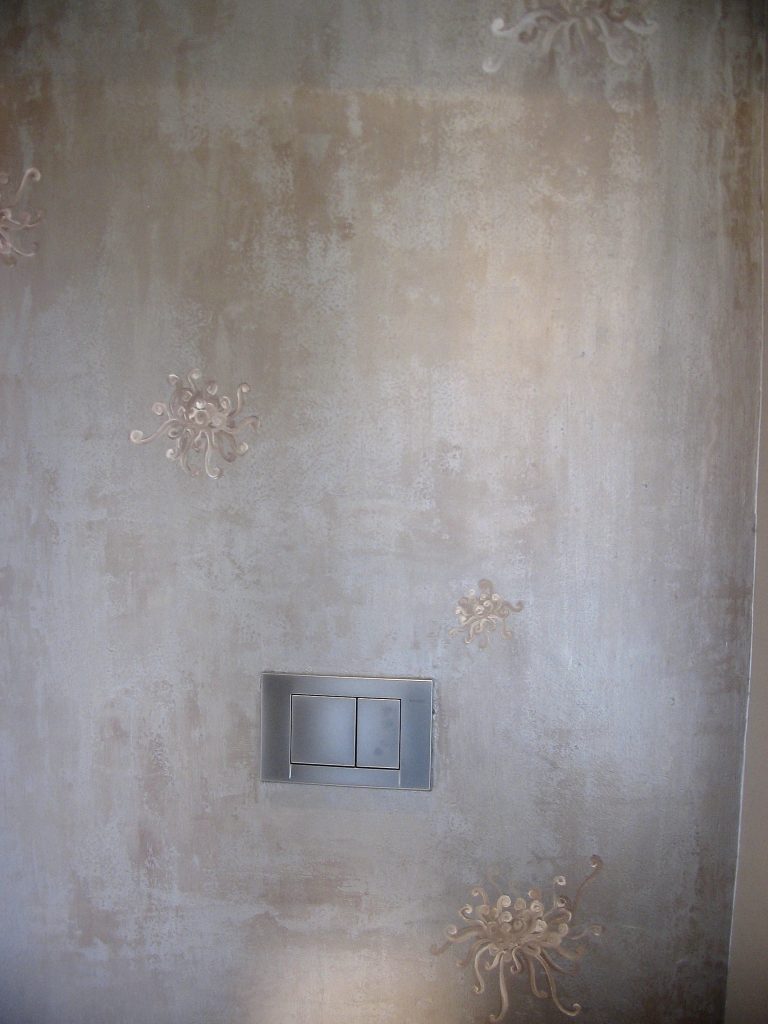 aged, scraped effect with metallic paint and motif